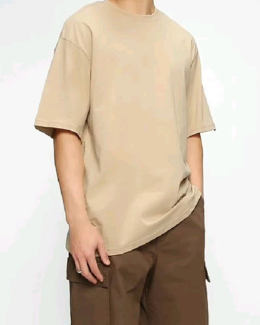Hyraa Club beige oversized tshirt with loose fit worn with brown cargo pants
