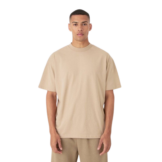 Hyraa Club beige oversized tshirt with short sleeves worn by male model standing straight